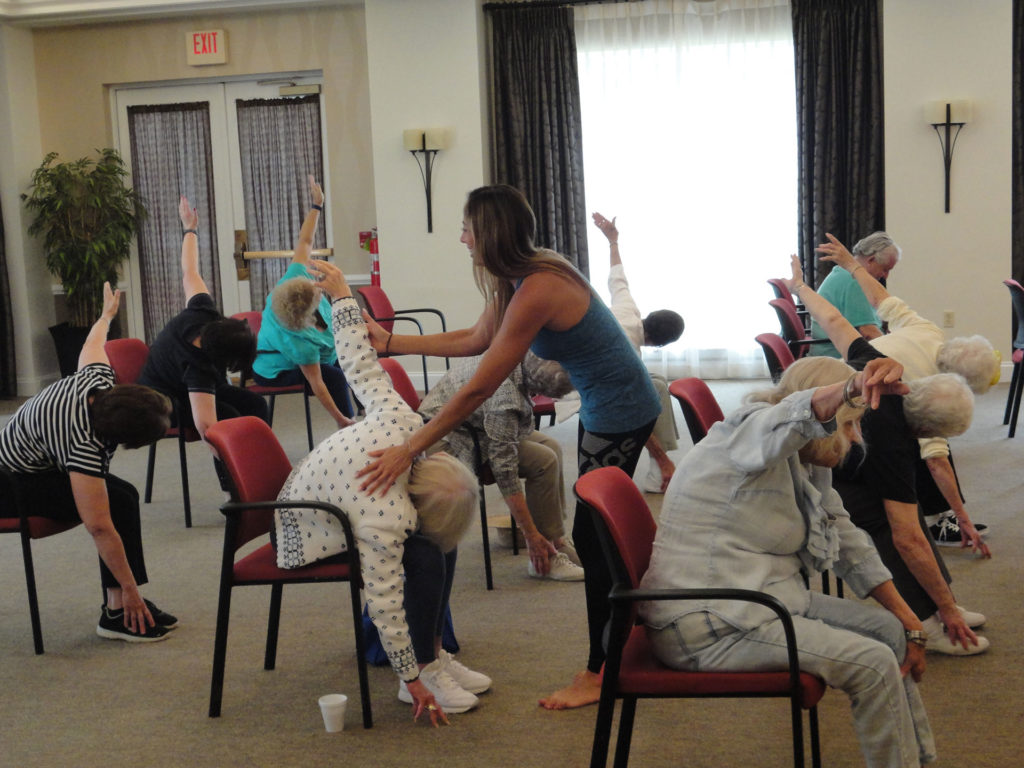 Sulekha adjusting senior exercising